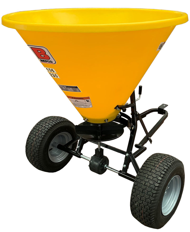 Yellow BEFCO Baby-Hop spreader with high-flotation tires and tubular steel frame for smooth operation on lawns
