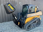 John Deere Skid steer with a cement mixer attachment