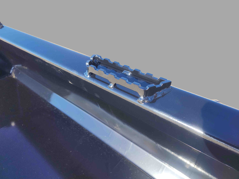 Close-up of EIP Skid Steer Bucket's integrated step, providing safe access for maintenance and operation.