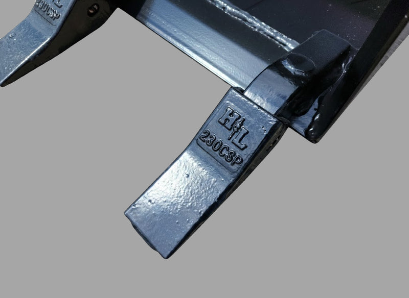 Detailed view of H&L tooth on skid steer bucket, emphasizing durability and precise alignment.