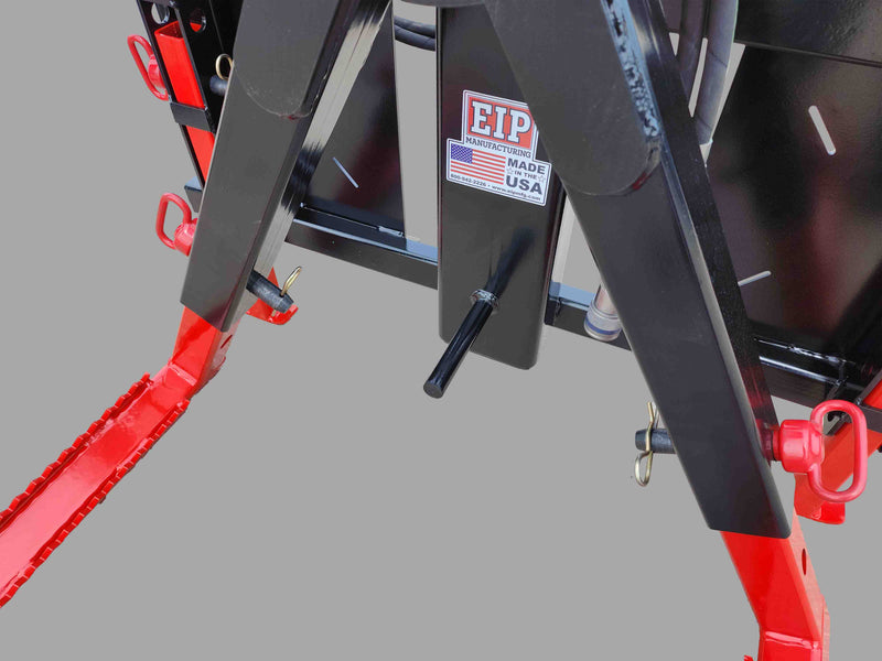 Base of the skid steer tire grabber, showing the EIP Manufacturing logo and sturdy steel support legs.