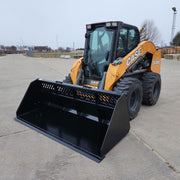 Skid steer equipped with XL High Capacity Open Back Bucket, parked on concrete, ready for material handling.