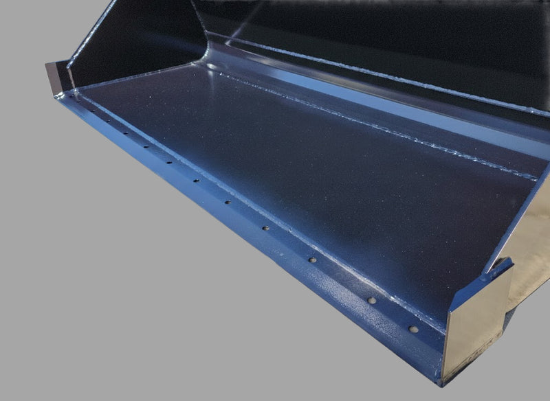 Close-up of Skid Steer Material Bucket's cutting edge, showcasing durable steel construction and powder-coated finish.