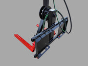 Side view of the skid steer tire grabber attachment, displaying the hydraulic hoses and steel frame.