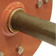 Close-up of BEFCO core aerator's rotor shaft with bronze bushing, emphasizing durability and maintenance ease.
