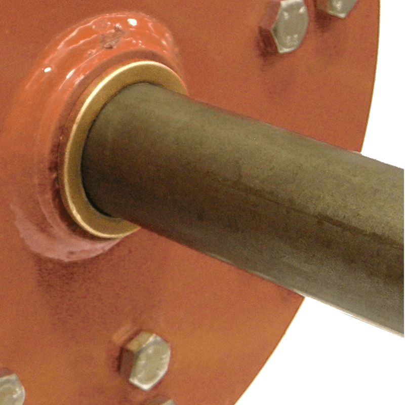 Close-up of BEFCO core aerator's rotor shaft with bronze bushing, emphasizing durability and maintenance ease.