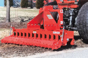 BEFCO BPL HD Soil Pulverizer in action, attached to a tractor, leveling soil on a grassy field.