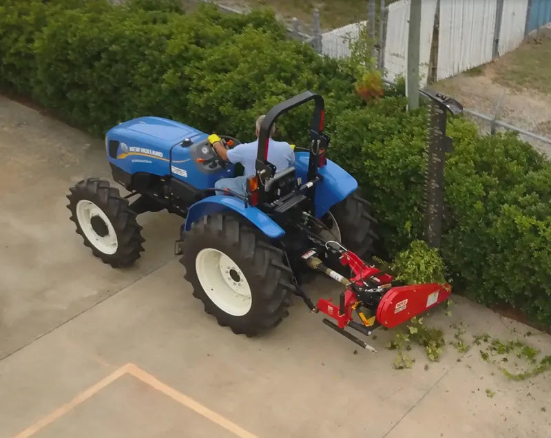 Overhead view of tractor with BEFCO Sickle Bar Mower cutting hedges, illustrating vertical cutting angle.