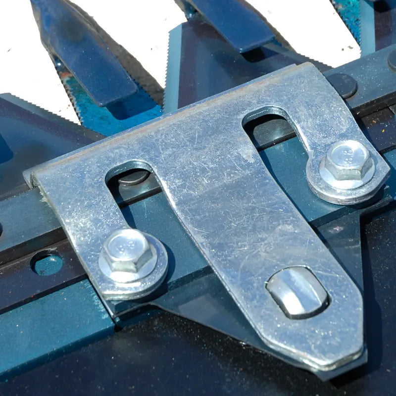 Close-up of BEFCO Sickle Bar Mower's bolt-on serrated tooth sections, emphasizing durability and ease of replacement.