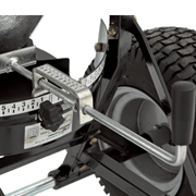 Close-up of BEFCO spreader's adjustable gate control, enabling precise material flow and distribution settings