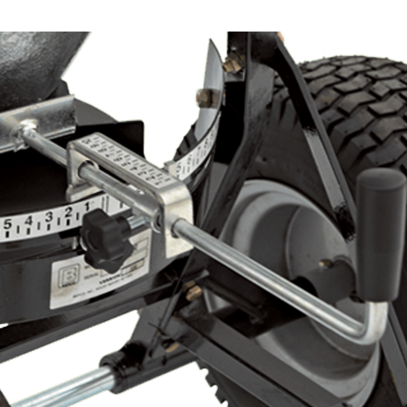 Close-up of BEFCO spreader's adjustable gate control, enabling precise material flow and distribution settings