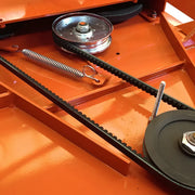 Detail of BEFCO mower's belt drive system, featuring heavy-duty reinforced belts and spring-loaded tensioner.