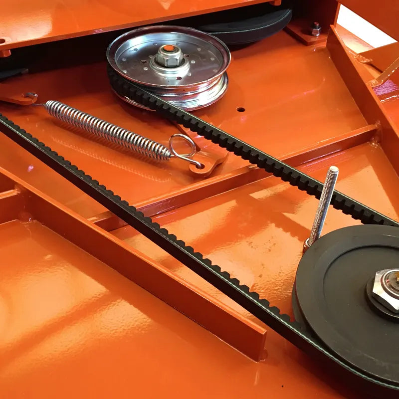 Detail of BEFCO mower's belt drive system, featuring heavy-duty reinforced belts and spring-loaded tensioner.