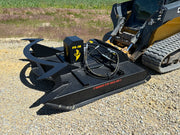 Brush cutter attached to a skid steer