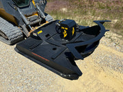 Brush cutter on a skid steer - left side view