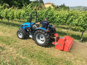 Compact tractor using BEFCO flail mower in a vineyard, demonstrating efficient mowing along tight rows.