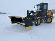 SPXR snow pusher attached to a loader, ready for action in snowy conditions with its durable design.