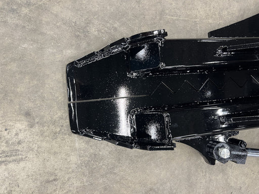 Zoom in of black metal machine part