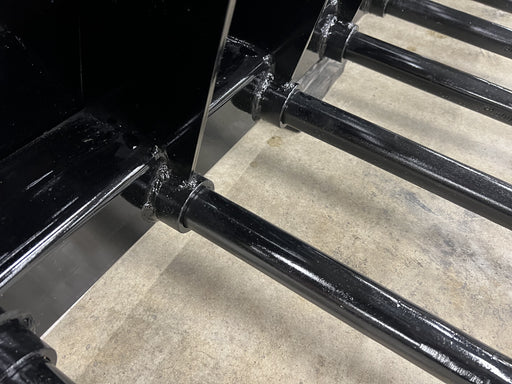 Close up view of manure bucket tines