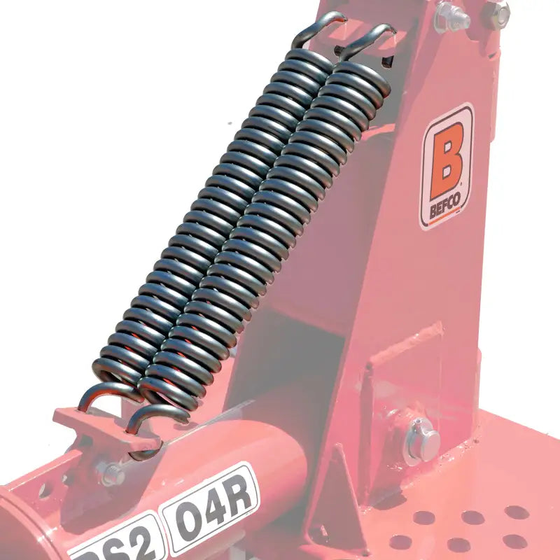Detail of BEFCO hay rake's spring assembly, showing robust construction for smooth ground contour following.