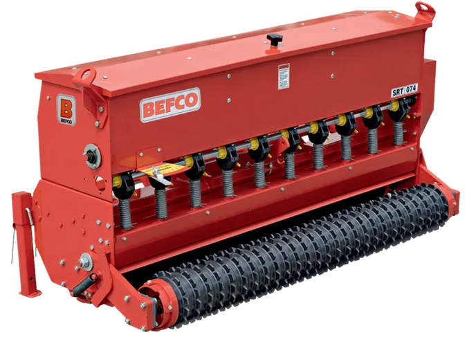 BEFCO 74-inch 3-point tractor seeder with red steel frame, featuring ten metering cups and corrugated roller.