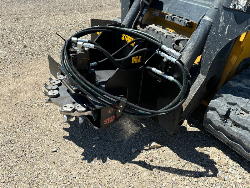 Stump grinder on a skid steer - close up left view