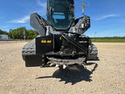 Stump grinder on a skid steer - front view