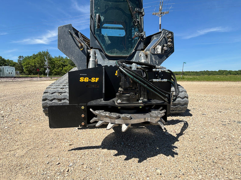 Stump grinder on a skid steer - front view