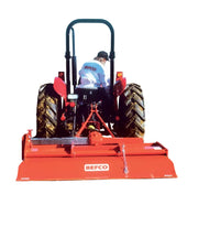 Rear view of tractor with BEFCO TILL-RITE T60 rotary tiller, red, illustrating attachment and operation