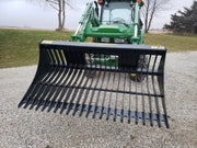 Green John Deer Tractor with black tractor rock bucket RK-72 Stinger Attachment