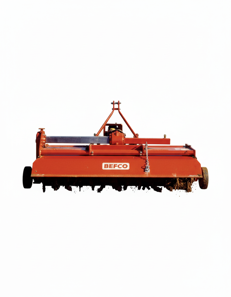 Front view of BEFCO TILL-RITE T60 rotary tiller, red, showing soil engagement and blade action