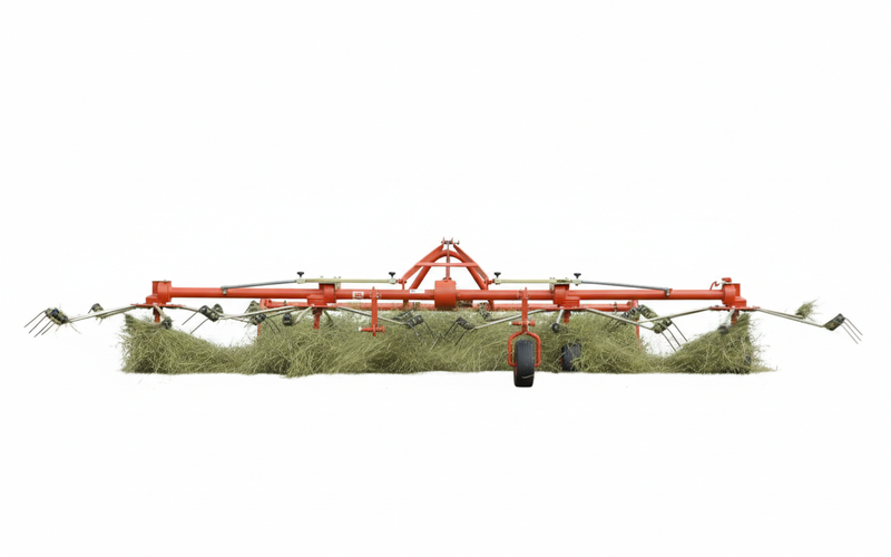 Front view of BEFCO DRP-300 hay tedder in action, spreading hay evenly for faster drying and better bale quality.