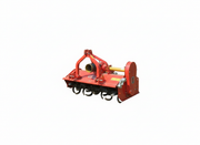 Red BEFCO flail mower with visible blades and hitch, designed for compact tractors, showcasing robust construction.